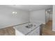 Kitchen featuring stainless appliances, granite countertops, and center island with a sink at 116 Central Townes Way # 293, Raleigh, NC 27603
