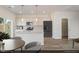 Charming kitchen with stainless appliances, white cabinets, granite countertops, and an island at 116 Central Townes Way # 293, Raleigh, NC 27603