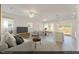 Open concept living room and dining area with modern decor and a sliding glass door at 116 Central Townes Way # 293, Raleigh, NC 27603