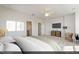 Spacious main bedroom with neutral walls, carpet, ceiling fan, and ensuite bathroom at 116 Central Townes Way # 293, Raleigh, NC 27603