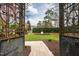 Backyard featuring a stone walkway, an ornate fountain, and a lush lawn at 12132 Lockhart Ln, Raleigh, NC 27614
