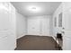 Unfinished basement featuring neutral walls, carpet, and bright white doors at 12132 Lockhart Ln, Raleigh, NC 27614