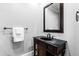 Classic bathroom with a dark wood vanity and black marble countertop at 12132 Lockhart Ln, Raleigh, NC 27614