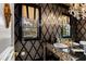 The bathroom features a decorative mirror, granite countertop, wallpaper, and sconces at 12132 Lockhart Ln, Raleigh, NC 27614