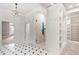 The bathroom features tile floors, a glass enclosed shower, a chandelier, and a walk-in closet at 12132 Lockhart Ln, Raleigh, NC 27614