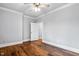 Comfortable bedroom featuring hardwood floors, neutral paint, and ceiling fan at 12132 Lockhart Ln, Raleigh, NC 27614