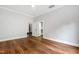 Spacious bedroom featuring gleaming wood floors, neutral walls, and bright white trim at 12132 Lockhart Ln, Raleigh, NC 27614