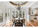 Breakfast nook featuring a chandelier, mural art, and an abundance of natural light at 12132 Lockhart Ln, Raleigh, NC 27614