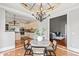 Breakfast nook with designer lighting, a round table, and access to the kitchen and Gathering room at 12132 Lockhart Ln, Raleigh, NC 27614