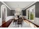 Sophisticated dining room with chandelier, French doors, and elegant furniture at 12132 Lockhart Ln, Raleigh, NC 27614