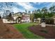 Beautiful house featuring mature landscaping, a driveway, and blossoming trees at 12132 Lockhart Ln, Raleigh, NC 27614