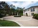 View of the exterior, revealing the property's expansive circular driveway and meticulously manicured grounds at 12132 Lockhart Ln, Raleigh, NC 27614