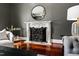 Cozy fireplace with an ornate mantel, decorative mirror, and inviting seating area at 12132 Lockhart Ln, Raleigh, NC 27614