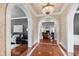 View from foyer with arched doorways leading to beautifully decorated living spaces at 12132 Lockhart Ln, Raleigh, NC 27614