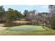 Scenic golf green located near a tranquil lake, providing a beautiful and relaxing atmosphere for golf enthusiasts at 12132 Lockhart Ln, Raleigh, NC 27614