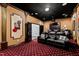 An inviting home theater boasts plush leather seating, elegant wall decor, and a cozy ambiance for movie nights at 12132 Lockhart Ln, Raleigh, NC 27614