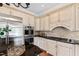 Kitchen with granite countertops, stainless appliances, custom cabinets and a center island at 12132 Lockhart Ln, Raleigh, NC 27614