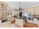 Open kitchen boasts stainless steel appliances, granite countertops, and a center island at 12132 Lockhart Ln, Raleigh, NC 27614