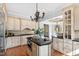 Gourmet kitchen featuring granite countertops, custom cabinetry, and modern appliances at 12132 Lockhart Ln, Raleigh, NC 27614