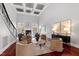 Bright living room with vaulted ceilings, fireplace, and elegant seating arrangement at 12132 Lockhart Ln, Raleigh, NC 27614