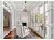 The living room has wood floors, large windows, a fireplace, and furniture at 12132 Lockhart Ln, Raleigh, NC 27614