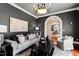 Elegant living room featuring dark walls, chandelier lighting, and stylish furniture arrangement at 12132 Lockhart Ln, Raleigh, NC 27614