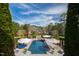 Enjoy this backyard with a pool, complete with a waterfall feature and scenic views of the surrounding landscape at 12132 Lockhart Ln, Raleigh, NC 27614