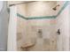 Beautiful tiled shower with a built-in bench and rainfall showerhead at 12132 Lockhart Ln, Raleigh, NC 27614