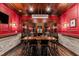 Stunning wine cellar with custom racking, stone accents, and a rustic dining table for intimate gatherings at 12132 Lockhart Ln, Raleigh, NC 27614