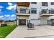 Multiple townhome garages and balconies of these white sided buildings provide ample parking and outdoor living space at 1249 S Blount Street # 101, Raleigh, NC 27601