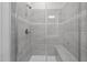 Modern bathroom shower showcasing tile surround, glass door, and convenient bench seating at 1254 White Flint Cir, Durham, NC 27703