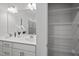 Bright bathroom with double vanity, sleek fixtures, and a linen closet with shelving at 1254 White Flint Cir, Durham, NC 27703