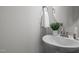Bathroom featuring a pedestal sink, round mirror and neutral wall color at 1254 White Flint Cir, Durham, NC 27703