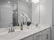 Bathroom featuring double sinks, modern fixtures, and a framed mirror at 1254 White Flint Cir, Durham, NC 27703