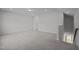 A spacious bonus room featuring neutral paint, carpet, and staircase access at 1254 White Flint Cir, Durham, NC 27703