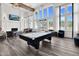 Bright clubhouse featuring a billiards table, comfortable seating, a fireplace, and large windows with outdoor views at 1254 White Flint Cir, Durham, NC 27703