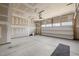Spacious garage with an automatic door, drywall, and concrete flooring, awaiting your personal touches at 1254 White Flint Cir, Durham, NC 27703