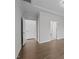 Hallway with hardwood floors and multiple doorways at 1254 White Flint Cir, Durham, NC 27703