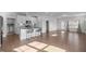 Stylish kitchen with a center island, stainless steel appliances, and views to the back patio and hardwood flooring at 1254 White Flint Cir, Durham, NC 27703