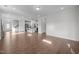 Spacious open-concept layout with hardwood floors connecting living and kitchen areas at 1254 White Flint Cir, Durham, NC 27703