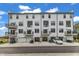 Townhouse complex boasting a clean, modern look with white exteriors, balconies, and convenient garage parking at 1257 S Blount Street # 101, Raleigh, NC 27601