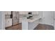 Bright, modern kitchen with stainless steel appliances, white cabinetry and eat-in island at 1257 S Blount Street # 101, Raleigh, NC 27601