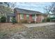 Brick home's backyard featuring a brick patio, offering a cozy outdoor living space at 127 Wilkinson St, Rocky Mount, NC 27804