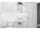 Cozy bathroom with white fixtures, retro sink, and ample counter space at 127 Wilkinson St, Rocky Mount, NC 27804
