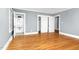 A spacious bedroom showcasing hardwood floors, a closet, and an adjoining bathroom at 127 Wilkinson St, Rocky Mount, NC 27804