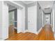 An inviting hallway with hardwood floors leading to various rooms in the house at 127 Wilkinson St, Rocky Mount, NC 27804