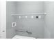 A functional laundry room featuring plumbing, electric outlets, and wire shelving above at 127 Wilkinson St, Rocky Mount, NC 27804
