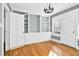 A charming living room with hardwood floors and elegant built-in cabinets and shelving at 127 Wilkinson St, Rocky Mount, NC 27804