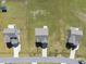 Top-down aerial view of neighborhood homes shows lots of grassy, fenced-in yards with driveways and garages at 147 Young Farm Dr, Lillington, NC 27546