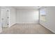 Bright bedroom with tan carpet, gray walls and a window at 147 Young Farm Dr, Lillington, NC 27546